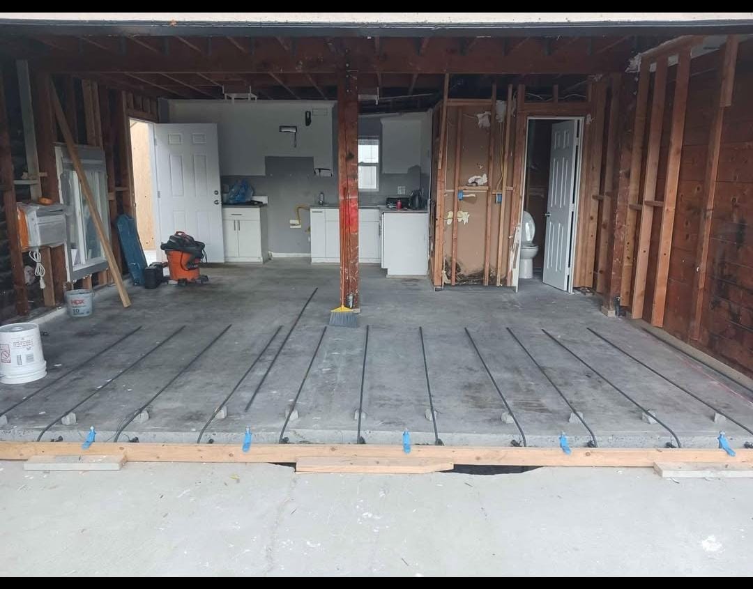 Garage conversion in progress with the slab prepared for the new floor