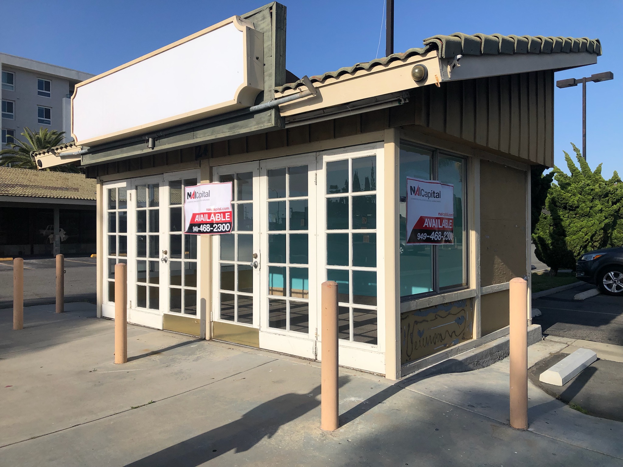 Small freestanding commercial building available for lease before a café tenant improvement